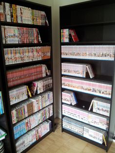 two black shelves filled with lots of video games