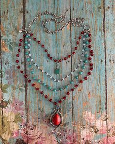 "v'¯) .`*.¸.*'❤ Southwestern Style! This DESIGN~ ❤ This necklace features 4 layers of cascading beaded glass chain in shades of red and turquoise. ❤ Dangling from the longest chain is a faux-stone acrylic western style medallion.  ❤ The shortest chain features a tiny turquoise glass bead. ❤ A tiny puffed heart dangles from the side adding a unique look. ❤ Longest chain measures approximately 22\", while shortest is at 16\" ❤ To Purchase Coordinating Leather Cuff! ❤ https://www.etsy.com/listing/1 Western Handmade Jewelry, Southwestern Style Red Necklace With Polished Beads, Southwestern Style Red Beaded Necklace, Southwestern Multi-strand Necklace With Gemstone Beads, Native Necklace, Red Southwestern Hand-strung Beaded Necklaces, Sundance Jewelry, Luxury Southwestern Hand-strung Beaded Necklaces, Southwestern Necklace