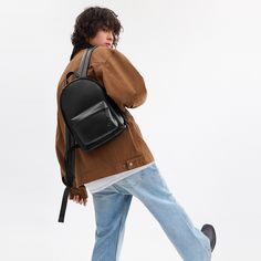 Our Hall is made for doing it all (just like you). This compact Backpack 22 has an open main compartment interior organization pockets and an exterior pocket for easy access to essentials. Featuring our Signature hardware and adjustable shoulder straps it’s crafted of our pliable lightest weight leather with a smooth soft finish. (Lighten up.) | Coach Hall Backpack 22 - Black Compact Backpack, Interior Organization, Open Main, Backpack Charm, Large Wallet, Signature Hardware, New Handbags, Belt Bag, Easy Access