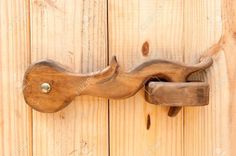 an old wooden door handle on the side of a building