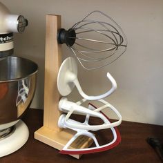 a kitchen mixer and stand mixer on a table