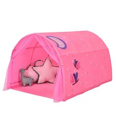 a child's tent with a pink bed inside