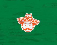 an image of a man with a beard and mustache wearing a sombrero on a green background