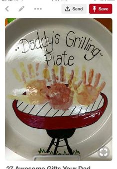 a plate with handprints on it that says daddy's grilling plate