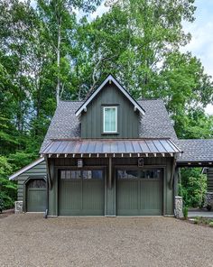 this is an image of a two car garage in front of a wooded area with lots of trees