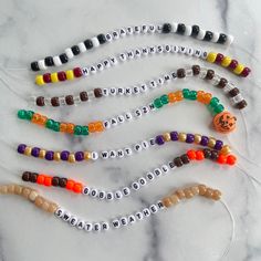 halloween candy bead necklaces with happy thanksgiving written on them