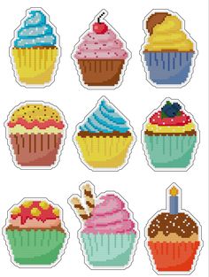 cross stitch cupcakes in different colors and designs on a white background, each with a single candle