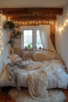 a bedroom with lights strung from the ceiling and blankets on the bed, along with fur rugs