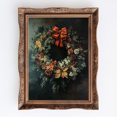 a painting of a wreath hanging on the wall with an orange bow and pine cones