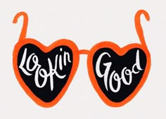 two heart shaped sunglasses with the words love in good written on them