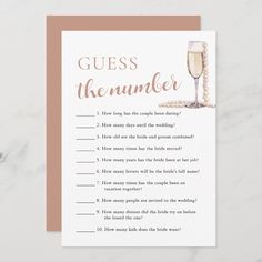 a card with the words guess the number and a glass of champagne on top of it