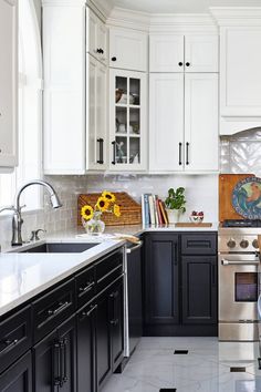 the kitchen is clean and ready to be used for cooking or baking, with sunflowers in vases on the counter