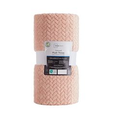 two rolls of pink knitted fabric on white background