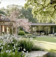 an artist's rendering of a modern house in the garden with trees and flowers