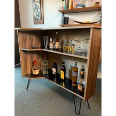 an open shelf with liquor bottles on it