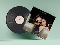 an old vinyl record with two women in sunglasses on the cover and one is black