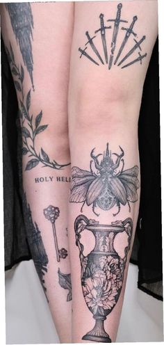 two tattoos on both legs, one with a bee and the other with flowers in vases