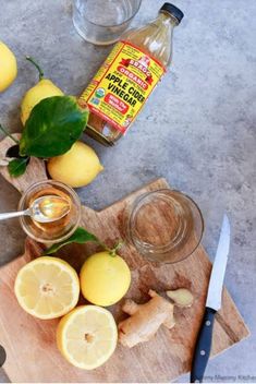 lemons and ginger syrup on a cutting board