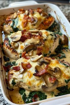 a casserole dish with chicken, mushrooms and spinach on it's side