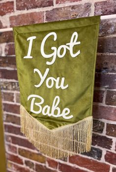 i got you bake banner hanging on a brick wall