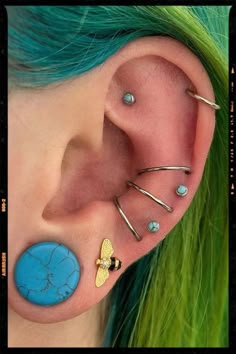 3x conch-to-helix orbital piercings Ear Piercing Ideas With Stretched Ears, Unique Conch Jewelry, Orbital Piercing Conch, Helix Orbital Piercing, Conch Orbital, Piercings Cute, Double Conch, Different Ear Piercings