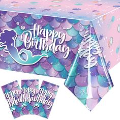 a mermaid themed birthday party table with purple and blue confetti