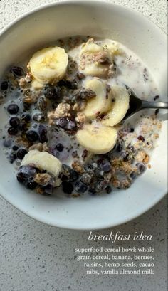 a bowl of cereal with bananas and blueberries