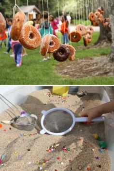 there are donuts hanging from strings in the yard and on the lawn, with sprinkles all over them