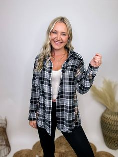 Contrast Flannel Casual Shirt with Frayed Hems Elevate your casual wardrobe with our Contrast Flannel Casual Shirt. This button-down, long sleeve shirt features a timeless black and white plaid pattern with a subtle pop of olive, adding a touch of modern flair. The frayed hem details throughout give it a relaxed, laid-back vibe, perfect for everyday wear. The relaxed fit ensures comfort and versatility, making it an ideal choice for a variety of settings. Wear it to a pumpkin patch outing, a cas