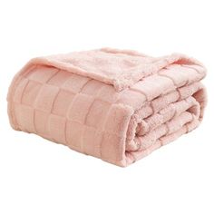 the pink blanket is folded on top of each other, and it looks like they have been