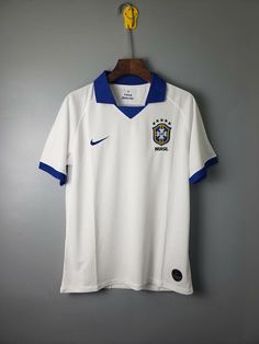 a soccer jersey hanging on a wall