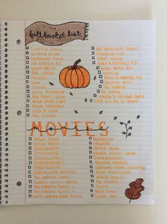 an open notebook with the words movies written in orange on it and a hand drawn pumpkin