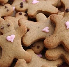 a pile of cookies with pink and brown decorations