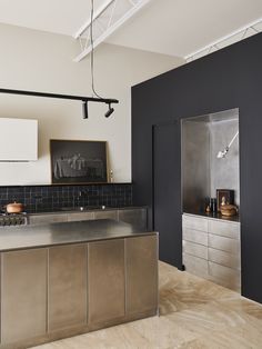 an industrial style kitchen with stainless steel appliances