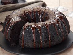 a bundt cake with chocolate icing on a plate