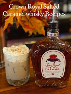 a bottle of crown royal salted caramel whisky next to a glass with whipped cream