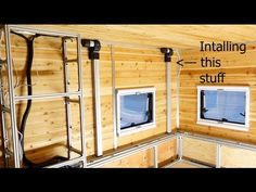 the inside of a small wooden cabin with windows and ladders on each side, showing how to install an insulated window