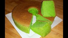 a cake with green icing on a white plate