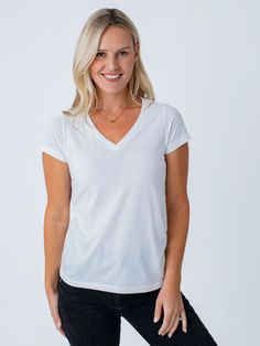 Imagine slipping into a cloud of pure comfort. Made with our signature soft fabric and designed for a flattering fit, it's the perfect combination of style and comfort. It's the tee you'll reach for again and again, because it just feels so darn good to wear. Our women’s tees now have an updated fit Improved shape across in all sizes to better fit women’s bodies True Plus sizing offered in our 2X and 3X sizes means our tees are cut using specific patterns to flatter your figure Unsung Hero, Tape Measures, White Crew Neck, Women Essentials, All White, Polished Look, V Neck Tee, Winter Women, Black Tee