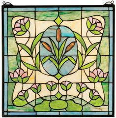 a stained glass window with flowers and leaves