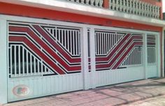 a red and white building with two doors