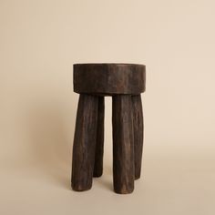 two wooden stools sitting on top of each other