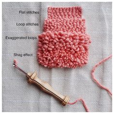 a pink crocheted mitt next to an electric toothbrush