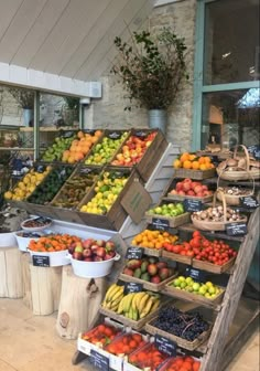 the fruit stand is full of many different types of fruits