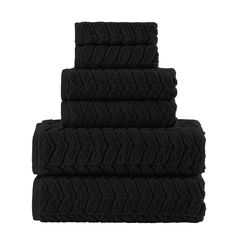 four black towels stacked on top of each other