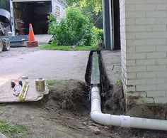 the pipes are being installed in front of the house to allow water for the basement