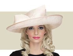 This soft gold Arbor hat is a modern take on the classic ladies hat. Get it here today along with many other elegant hats from Gold Coast Couture. Kentucky Derby Hats With Structured Crown, Luxury Gold Wide Brim Hat, Luxury Gold Hat For Kentucky Derby, Elegant Formal Hat With Structured Crown, Formal Hat With Structured Crown For Royal Ascot, Royal Ascot Formal Hat With Structured Crown, Luxury Formal Hats With Structured Crown, Royal Ascot Structured Crown Formal Hat, Luxury Formal Hat With Structured Crown