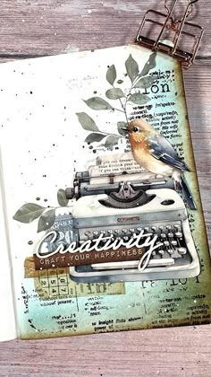 an old fashioned typewriter with birds on it