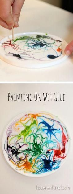 someone is painting on a plate with paint and the words, painting on wet glue