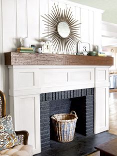 a living room filled with furniture and a fire place covered in a sunburst